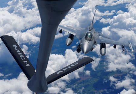 FILE PHOTO: A U.S. Air Force F-16 fighter approaches a KC-135 aerial refueling aircraft during the U.S. led Saber Strike exercise in the air over Estonia June 6, 2018. REUTERS/Ints Kalnins/File Photo