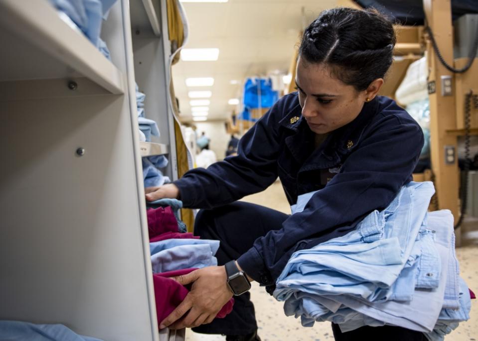 Chief Hospital Corpsman Dom Navarro, from Orange County, Calif., counts patient gowns in the medical ward aboard hospital ship USNS Mercy (U.S. Navy photo by Mass Communication Specialist 2nd Class Ryan M. Breeden)