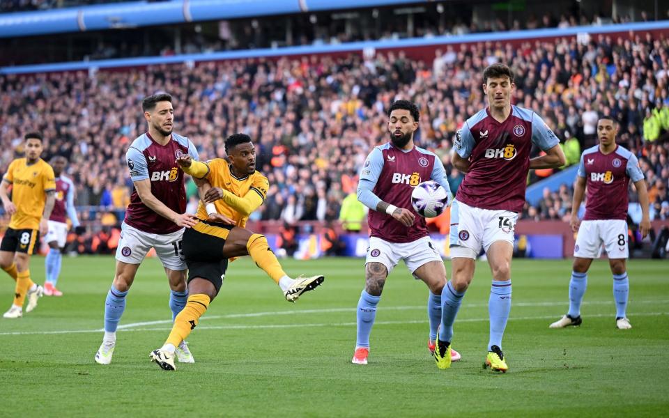 : Nelson Semedo of Wolverhampton Wanderers shoots whilst under pressure from Alex Moreno, Douglas Luiz and Pau Torres