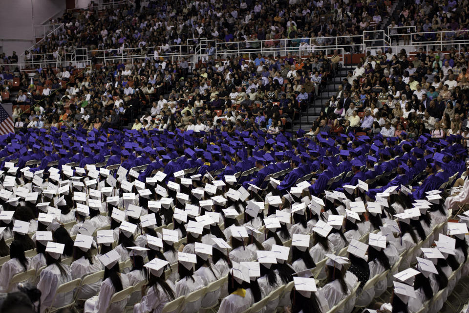 Newsweek has ranked Bayside High School in Bayside, New York, the tenth best high school for low-income students in America. In this photo, seniors sit during their 2011 graduation ceremony held on the St John's University campus in New York. 