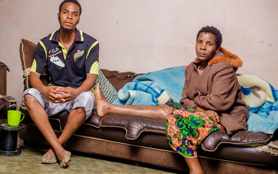 Rose Yohane with 26-year-old Martin Makhonje, the man who rescued her and her remaning surviving daughter - Henry Mhango