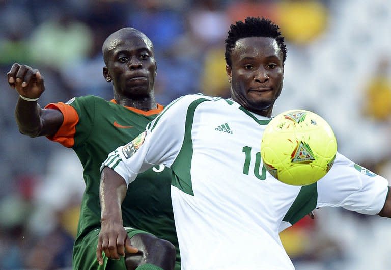 Nigeria's midfielder Mikel John Obi (R) clashes with Zambia's midfielder Chisamba Lungu during an Africa Cup of Nations 2013 group A football match at Mbombela Stadium in Nelspruit on January 25, 2013. The match ended in a 1-1 draw