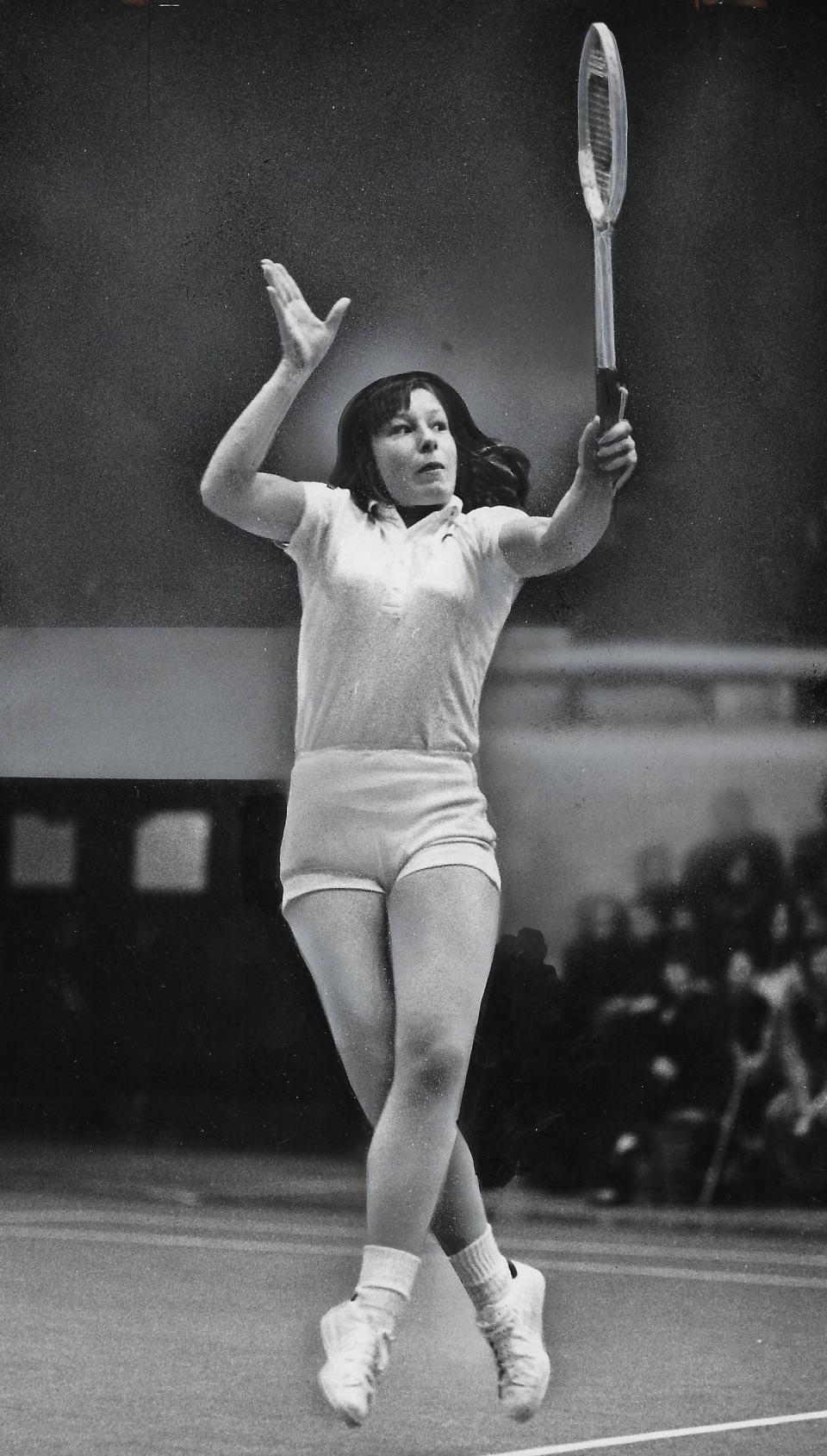 Martina Navratilova returns the ball to Chris Evert on March 22, 1973, in Akron.