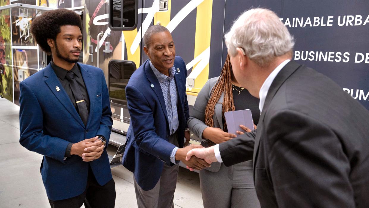 USDA Secretary Tom Vilsack listens to studentsÕ presentation about their Agricultural Mobile Education Unit after an event at Southern University, Baton Rouge, Louisiana, an 1890 land-grant institution. (USDA photo by Christophe Paul)