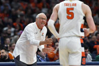 Syracuse head coach Jim Boeheim, left, gives instructions to guard Justin Taylor during the first half of an NCAA college basketball game against Virginia in Syracuse, N.Y., Monday, Jan. 30, 2023. (AP Photo/Adrian Kraus)