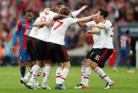 Britain Football Soccer - Crystal Palace v Manchester United - FA Cup Final - Wembley Stadium - 21/5/16 Manchester United players celebrate winning the final as Jason Puncheon looks dejected Action Images via Reuters / John Sibley