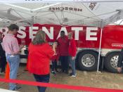 Republican U.S. Senate nominee Herschel Walker, a former University of Georgia football star, greets Georgia football fans Saturday, Dec. 3, 2022 before the Bulldogs' SEC Championship victory over the LSU Tigers in Atlanta. Walker faces Sen. Raphael Warnock, a Democrat, in a Tuesday runoff. Walker and Georgia Republicans, especially, have tried to capitalize on sports and college loyalties to connect with voters. (AP Photo/Bill Barrow)