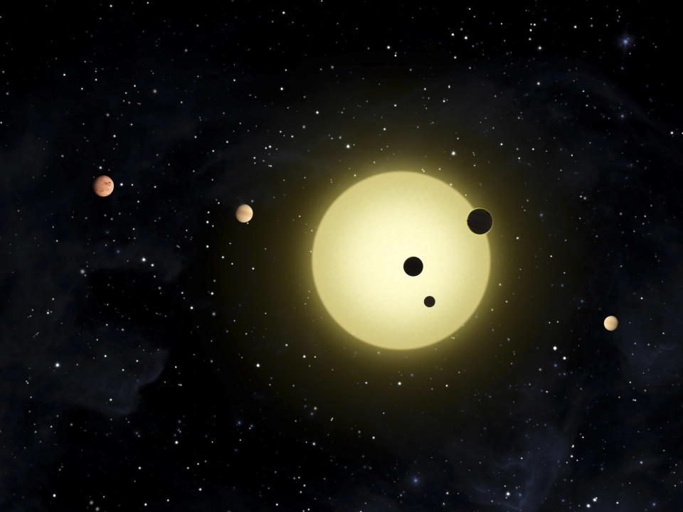 In this artist's conception released by NASA February 2, 2011, Kepler-11 is a sun-like star around which six planets orbit. At times, two or more planets pass in front of the star at once, as shown in a simultaneous transit of three planets observed by NASA's Kepler spacecraft on August 26, 2010. REUTERS/Tim Pyle/NASA/Handout