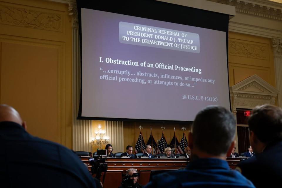 A picture of the members looking at a presentation about the investigation on the January 6 insurrection