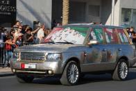 A car covered in what appears to be coins is part of the National Day parade held at Downtown Dubai. (Photo: Donna.M.Bee.Photography)