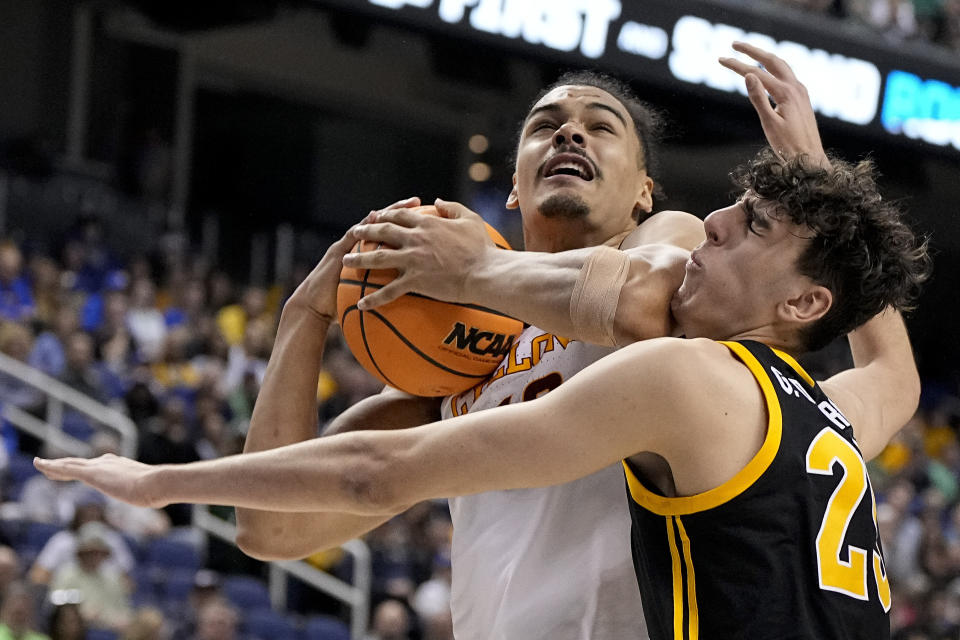 Iowa State forward Robert Jones battles Pittsburgh forward Guillermo Diaz Graham for a rebound during the second half of a first-round college basketball game in the NCAA Tournament on Friday, March 17, 2023, in Greensboro, N.C. (AP Photo/Chris Carlson)