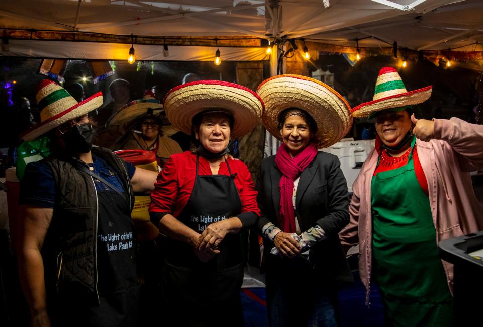 Some of the women of Tamales El Sinai pose for a photo together during the 30th annual Indio International Tamale Festival at Miles Avenue Park in Indio, Calif., Thursday, Dec. 1, 2022. 