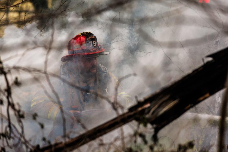 Hanover Area Fire & Rescue firefighter Josh Hale uses a hose line while extinguishing a fully involved RV fire in the 200 block of North Forney Avenue, Monday, April 1, 2024, in Hanover. No one was reported injured in the fire, which is under investigation.