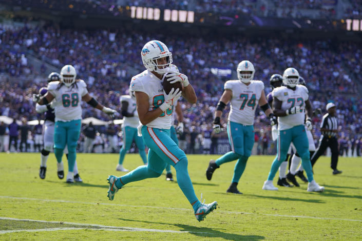 Miami Dolphins wide receiver River Cracraft (85) scores a touchdown during the second half of an NFL football game against the Baltimore Ravens, Sunday, Sept. 18, 2022, in Baltimore. (AP Photo/Julio Cortez)