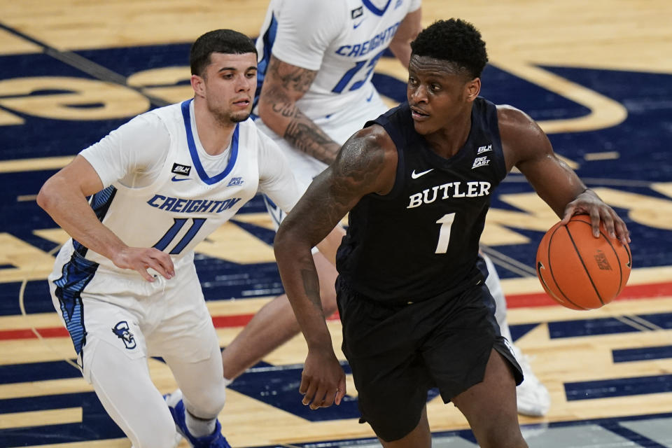 Butler's Bo Hodges (1) spins away from Creighton's Marcus Zegarowski (11) during the first half of an NCAA college basketball game in the Big East conference tournament Thursday, March 11, 2021, in New York. (AP Photo/Frank Franklin II)