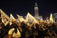 Demonstrators march during a protest in Lisbon March 6, 2014. REUTERS/Hugo Correia