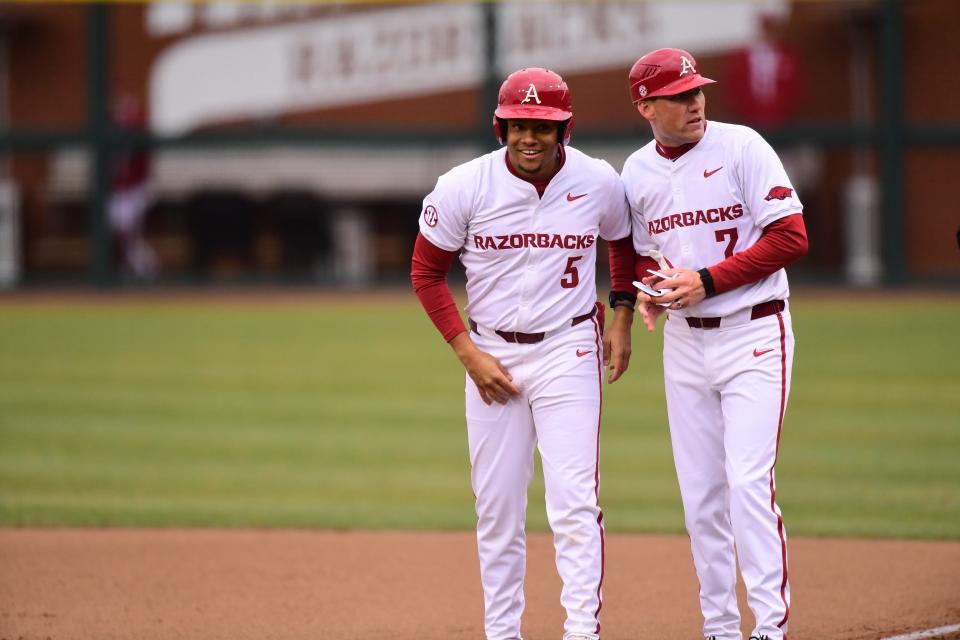 Arkansas baseball's Kendall Diggs (5) smiles after reaching base with a single in the Razorbacks' Opening Day win over James Madison on Friday, Feb. 16, 2024.