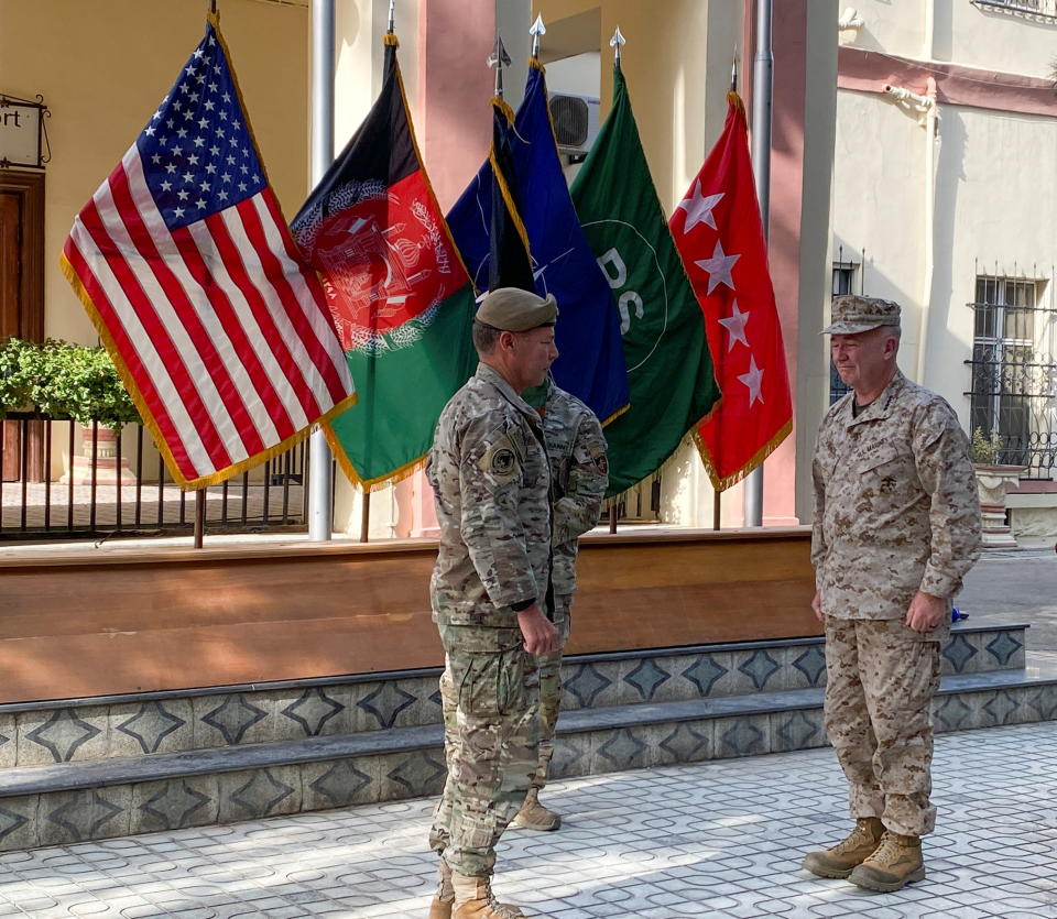 U.S. General Austin Miller, (L) and U.S. General Kenneth McKenzie,(R), at a ceremony in Kabul, as Miller relinquishes command during the final phase of America's withdrawal from the war in Afghanistan July 12, 2021.REUTERS/Phil Stewart