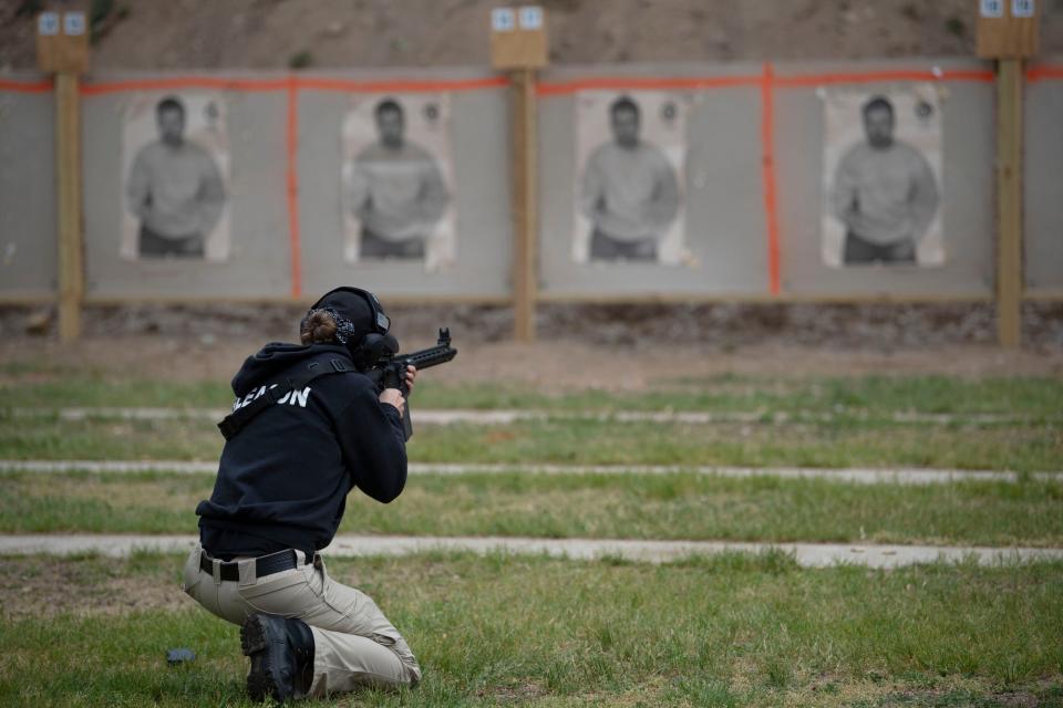 Kellogg Community College cadet Sara Gleason practices magazine changes at River Road Shooting Range in Battle Creek on Wednesday, May 18, 2022.
