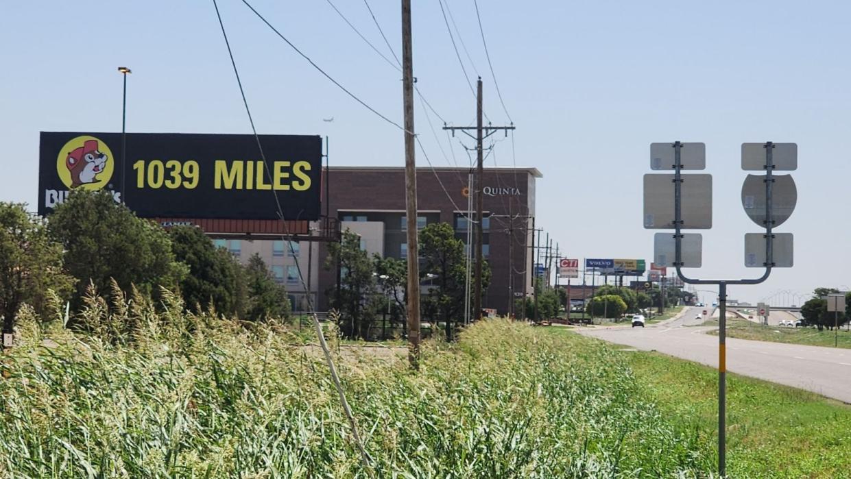 A billboard sign advertises a Buc-ee's location 1,039 miles away in Amarillo. The sign is located off of I-40, west of the Lakeside exit on the northside of the city, across from the Travel Information Center. An Amarillo Buc-ee's location is still in the works, according to officials.