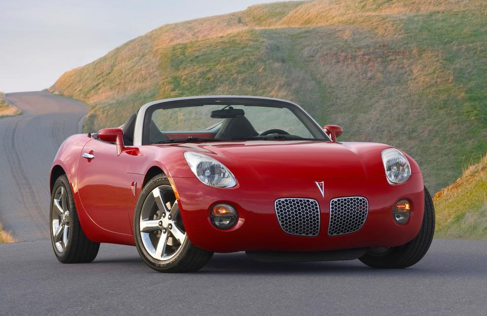 A red 2008 Pontiac Solstice Roadster.