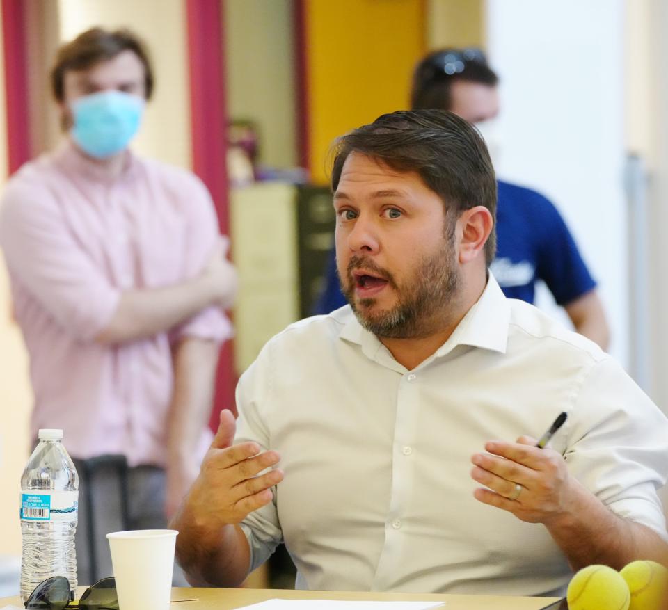 Rep. Ruben Gallego listens to community members and leaders during a listening session at Cesar Chavez High School Library on April 20, 2022, in Phoenix.