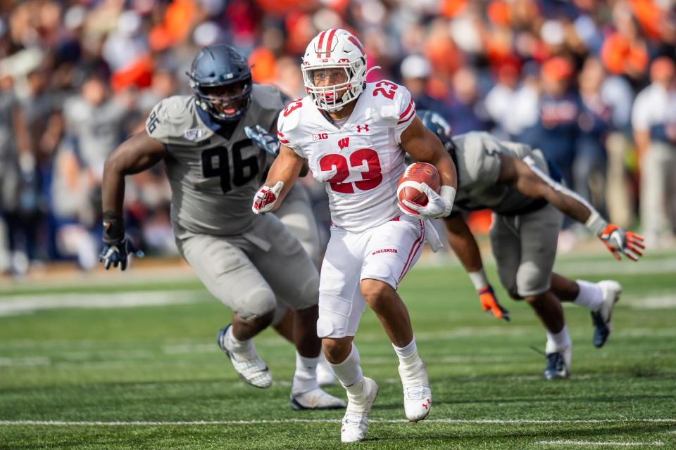 Oct. 19, 2019; Champaign, Illinois; Wisconsin Badgers running back Jonathan Taylor (23) runs the ball against the Illinois Fighting Illini during a game at Memorial Stadium. Patrick Gorski-USA TODAY Sports