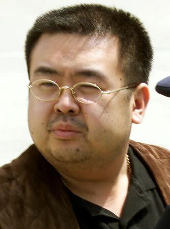 FILE PHOTO: A man believed to be North Korean heir-apparent Kim Jong Nam takes a look around as he boards a plane upon his deportation from Japan at Tokyo's Narita international airport May 4, 2001. REUTERS/Eriko Sugita/File Photo