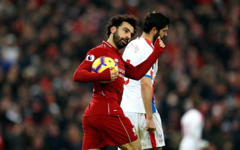 Liverpool's Mohamed Salah celebrates scoring his side's first goal of the game during the Premier League match at Anfield, Liverpool. PRESS ASSOCIATION Photo. Picture date: Saturday January 19, 2019. See PA story SOCCER Liverpool. Photo credit should read: Darren Staples/PA Wire. RESTRICTIONS: EDITORIAL USE ONLY No use with unauthorised audio, video, data, fixture lists, club/league logos or "live" services. Online in-match use limited to 120 images, no video emulation. No use in betting, games or single club/league/player publications - Credit: PA