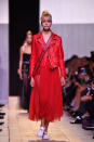 <p>A red leather jacket proved to be the ultimate femme fatale look. Combined with a matching tulle dress, this particular Dior girl was feisty and not one to be reckoned with.</p><p><i>[Photo: Getty]</i></p>