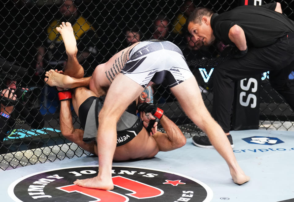 PERTH, AUSTRALIA - FEBRUARY 12: (R-L) Yair Rodriguez of Mexico secures a triangle choke submission against Josh Emmett in the UFC interim featherweight championship fight during the UFC 284 event at RAC Arena on February 12, 2023 in Perth, Australia. (Photo by Chris Unger/Zuffa LLC via Getty Images)