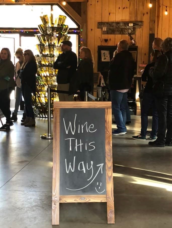 Patrons wait in line to purchase wine at Spring Run Vineyards in Chesterfield in December 2021.