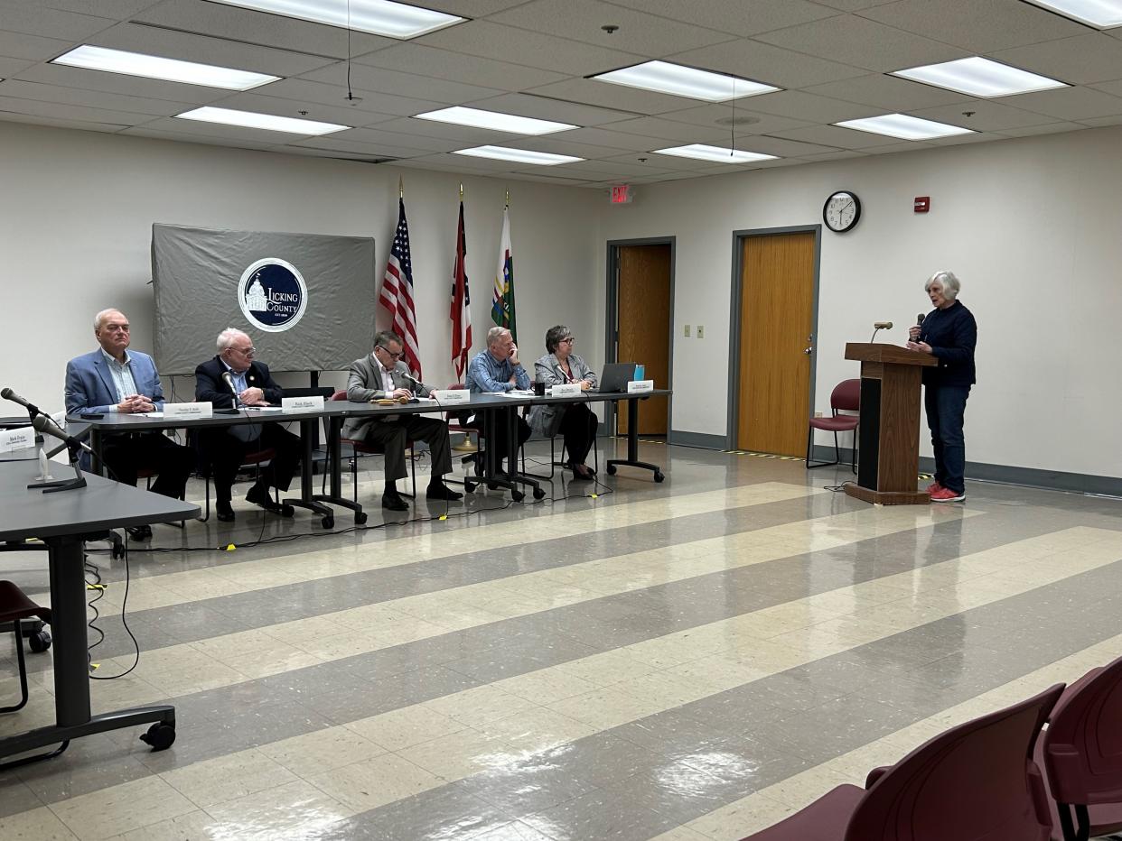 Etna resident Judy Cafmeyer, right, speaks before the Licking County Commissioner during a hearing Tuesday. After a request from the Etna Township Trustees, the commissioners held the hearing on whether to prohibit utility-scale solar farms within Etna Township.