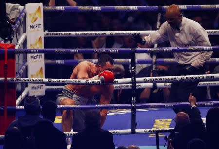 Britain Boxing - Anthony Joshua v Wladimir Klitschko IBF, IBO & WBA Super World Heavyweight Title's - Wembley Stadium, London, England - 29/4/17 Wladimir Klitschko receives a count by the referee after being knocked down by Anthony Joshua Action Images via Reuters / Peter Cziborra Livepic