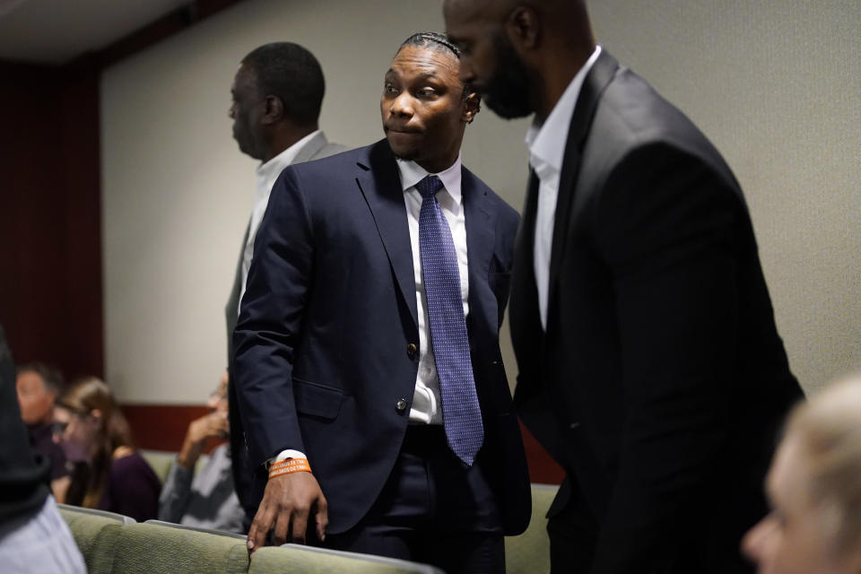 Former Las Vegas Raiders player Henry Ruggs, center, appears in court Wednesday, May 10, 2023, in Las Vegas. Ruggs plead guilty to driving his car drunk before causing a fiery crash that killed a woman. (AP Photo/John Locher)