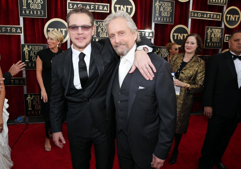 Matt Damon and Michael Douglas arrive at the 20th annual Screen Actors Guild Awards at the Shrine Auditorium on Saturday, Jan. 18, 2014, in Los Angeles. (Photo by Matt Sayles/Invision/AP)