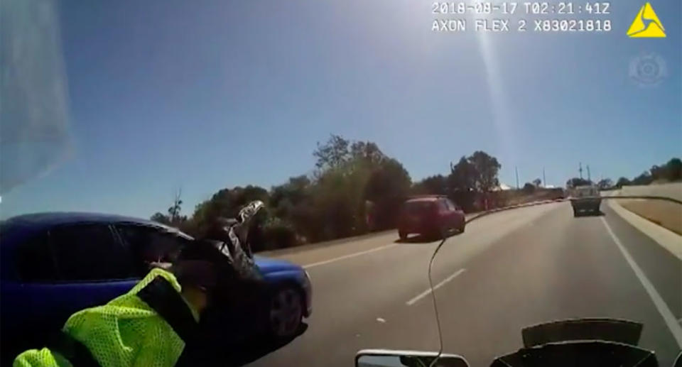 The policeman can be heard repeatedly telling the driver to pull over. Source: Queensland Police Service