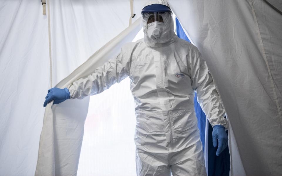 A doctor entering a triage facility in Turin - Stefano Guidi/Getty Images