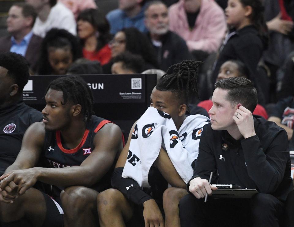 Texas Tech's guard Lamar Washington (1), center, sits on the bench during the first round of the Big 12 basketball tournament, Wednesday, March 8, 2023, at T-Mobile Center in Kansas City, Mo. 