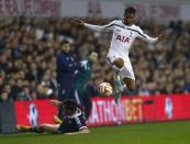 Tottenham Hotspur's Kyle Naughton (R) evades a tackle from Partizan Belgrade's Vladimir Volkov during their Europa League soccer match at White Hart Lane in London November 27, 2014. REUTERS/Eddie Keogh