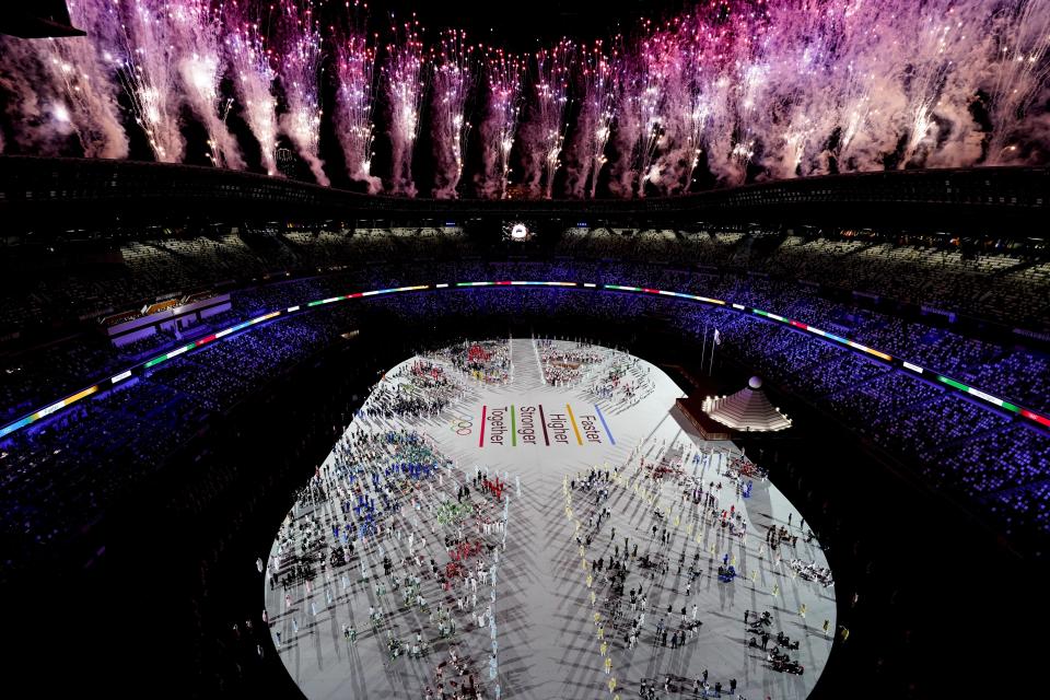 FILE - Fireworks are seen during the opening ceremony at the Olympic Stadium at the 2020 Summer Olympics, Friday, July 23, 2021, in Tokyo. Creative director Marco Balich, reveals to The Associated Press that he has been working for a year on a 30-minute show that will run ahead of the Soccer World Cup 2022 opening game between Qatar and Ecuador. He says local organizers "wanted to create a real show, which FIFA is not accustomed to.” (AP Photo/Morry Gash, File)