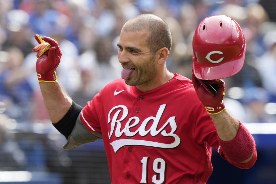 Cincinnati Reds' Joey Votto celebrates his solo home run against the Toronto Blue Jays during eighth-inning baseball game action in Toronto, Sunday, May 22, 2022. (Frank Gunn/The Canadian Press via AP)