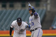 Kansas City Royals' Salvador Perez (13) reacts to his double as Detroit Tigers second baseman Jonathan Schoop (7) applies a late tag in the first inning of a baseball game in Detroit, Tuesday, Sept. 27, 2022. (AP Photo/Paul Sancya)