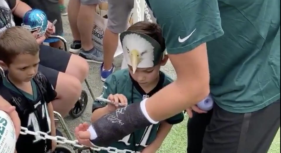 After breaking his wrist during preseason action, Philadelphia Eagles quarterback Nate Sudfeld had some young fans sign his cast at training camp. (Twitter//@Eagles)