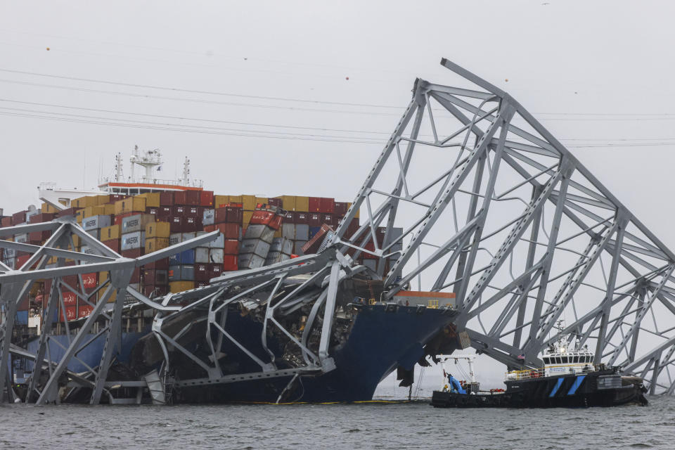 Wreckage of the Francis Scott Key Bridge rests on the container ship Dali, Wednesday, April 3, 2024, in Baltimore. (AP Photo/Julia Nikhinson)