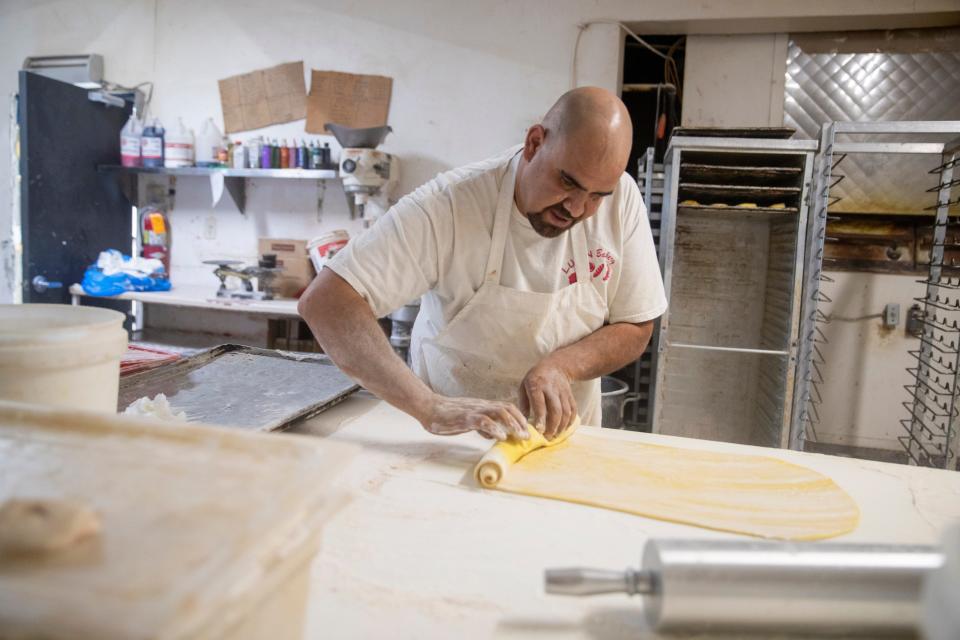 Head baker Jose Garcia prepares bread and pastries at Lujan’s Bakery on Tuesday, May 17, 2022. 