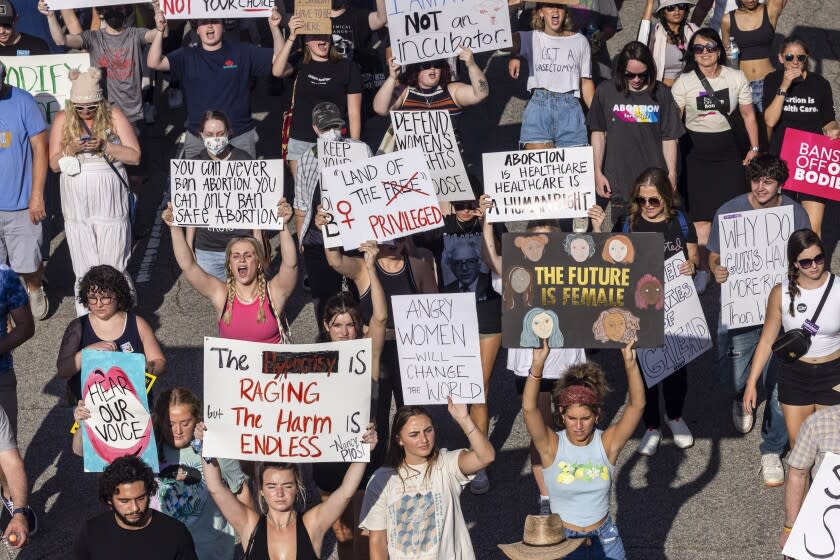 FILE - Hundreds of demonstrators rally and march in opposition to the U.S. Supreme Court's decision overturning Roe v. Wade in downtown Raleigh, N.C., on June, 24, 2022. Abortions in North Carolina are no longer legal after 20 weeks of pregnancy, a federal judge ruled Wednesday, Aug. 17, 2022 eroding protections in one of the South's few remaining safe havens for reproductive freedom. (Travis Long/The News & Observer via AP, File)