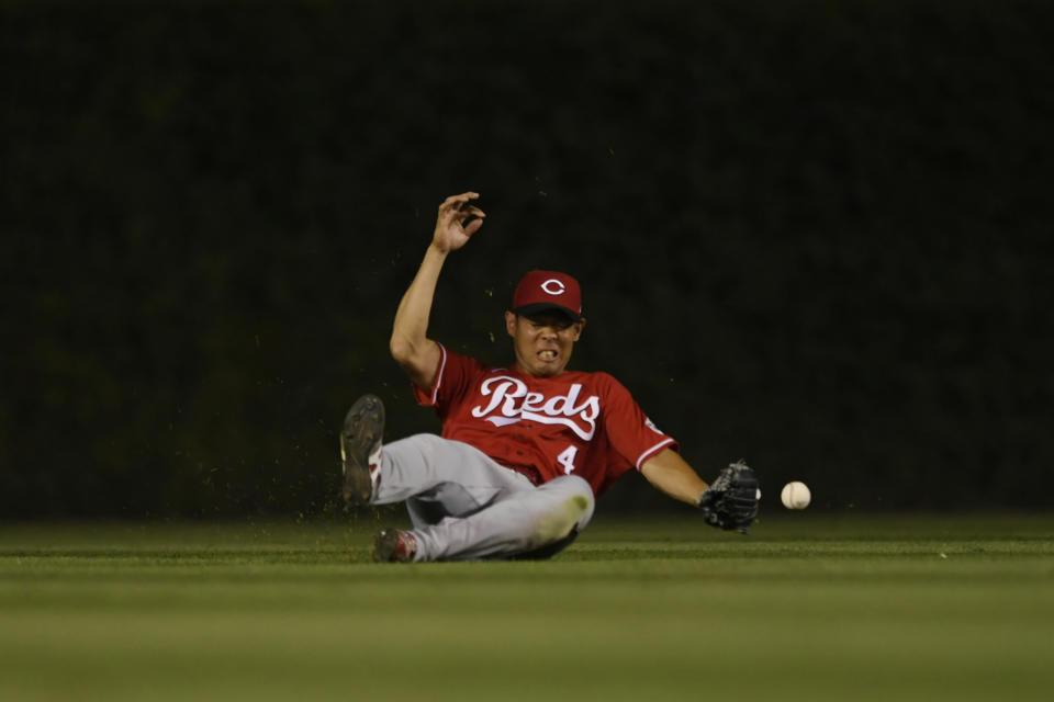 Cincinnati Reds center fielder Shogo Akiyama misses a fly ball hit by Chicago Cubs' Jake Marisnick during the fifth inning of a baseball game Monday, July 26, 2021, in Chicago. (AP Photo/Paul Beaty)