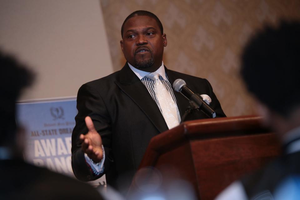 Former Michigan football assistant coach Tyrone Wheatley, the winner of Hal Schram award, speaks to the crowd during the 2015 Detroit Free Press Football Awards Banquet on Sunday, December 13, 2015, in Dearborn.