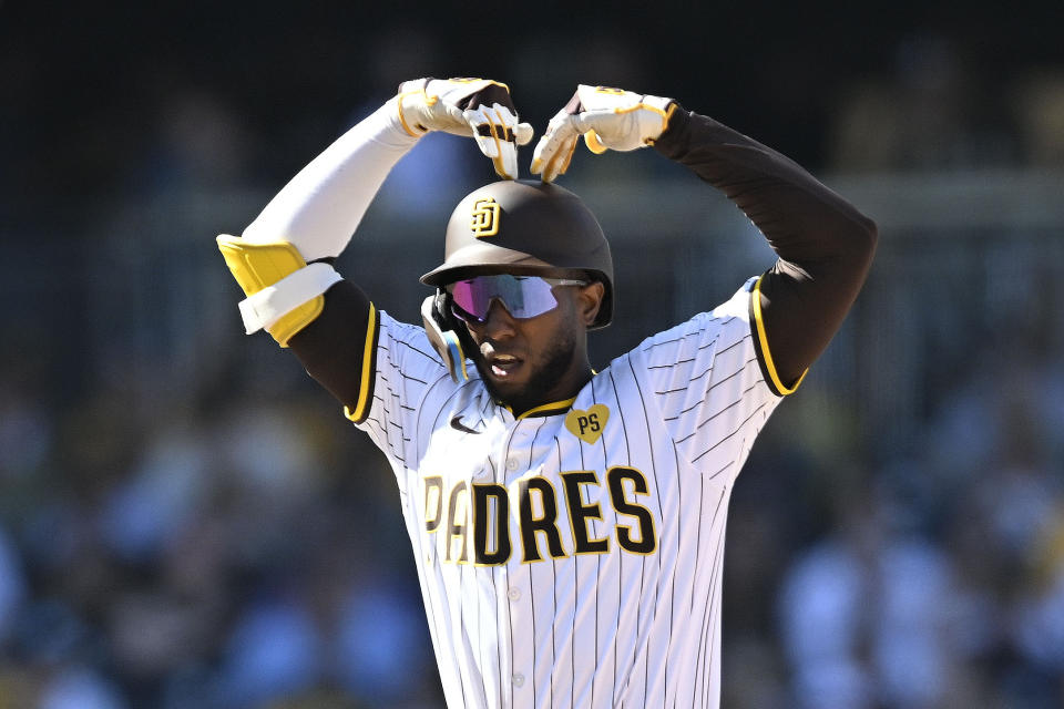 San Diego Padres' Jurickson Profar (10) gestures after hitting a double during the eighth inning of a baseball game against the St. Louis Cardinals, Wednesday, April 3, 2024, in San Diego. (AP Photo/Denis Poroy)